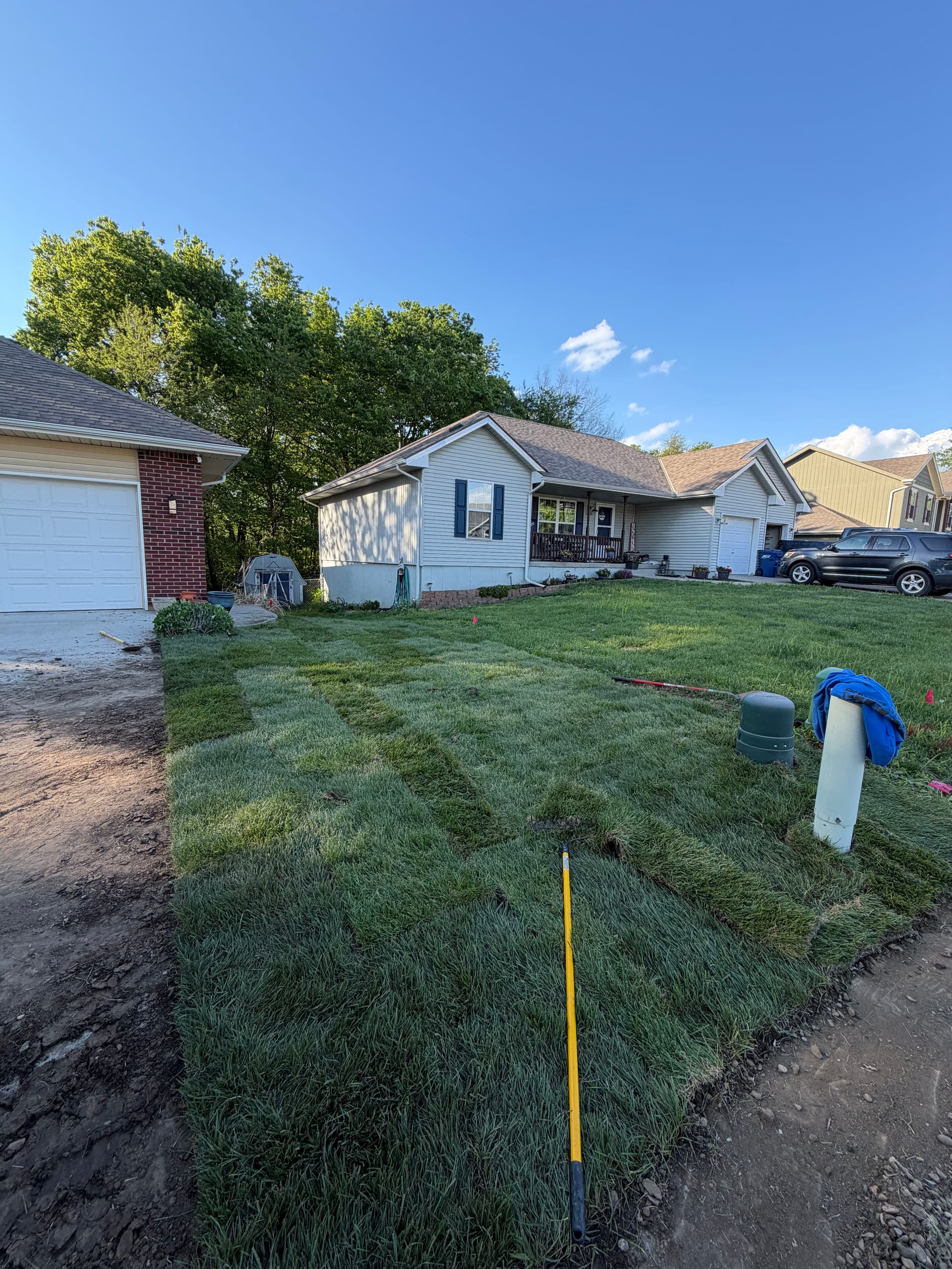 Two Sod Jobs in One Day - Rock Bed Removal and Patch Repair image