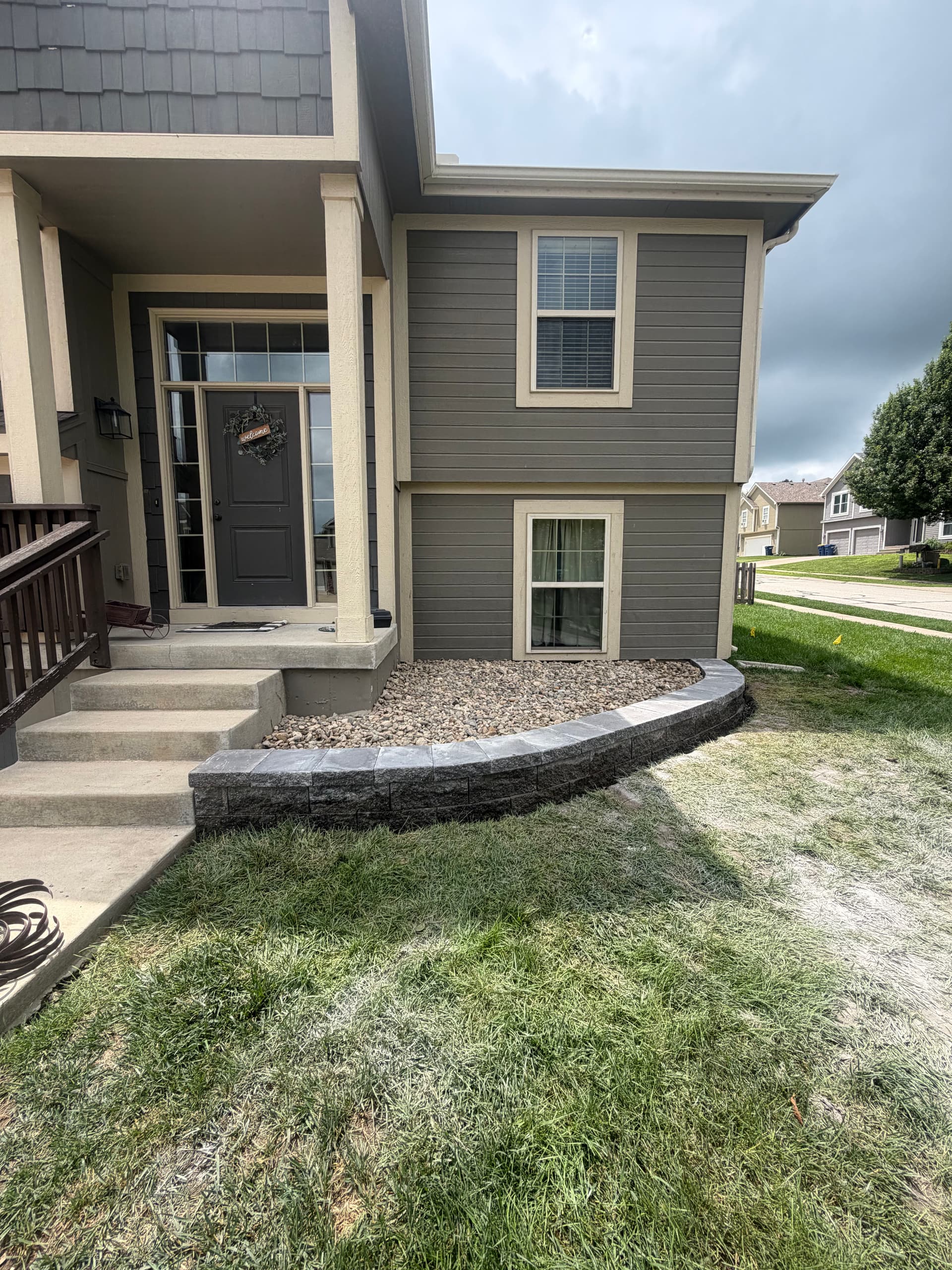 Gallery photos for Front Yard Landscape Bed with New Retaining Wall and Rock: Image #1
