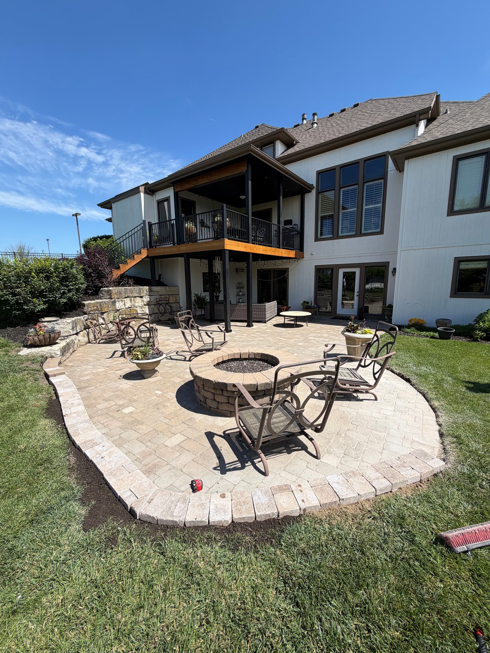 Paver Patio Reset With Drainage Fix and Retaining Wall