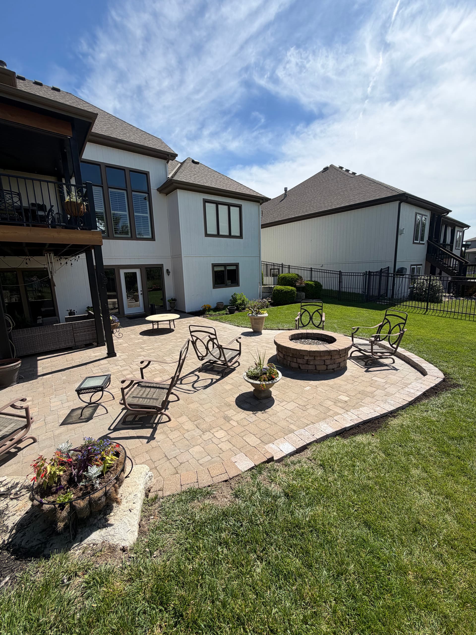 Paver Patio Reset With Drainage Fix and Retaining Wall