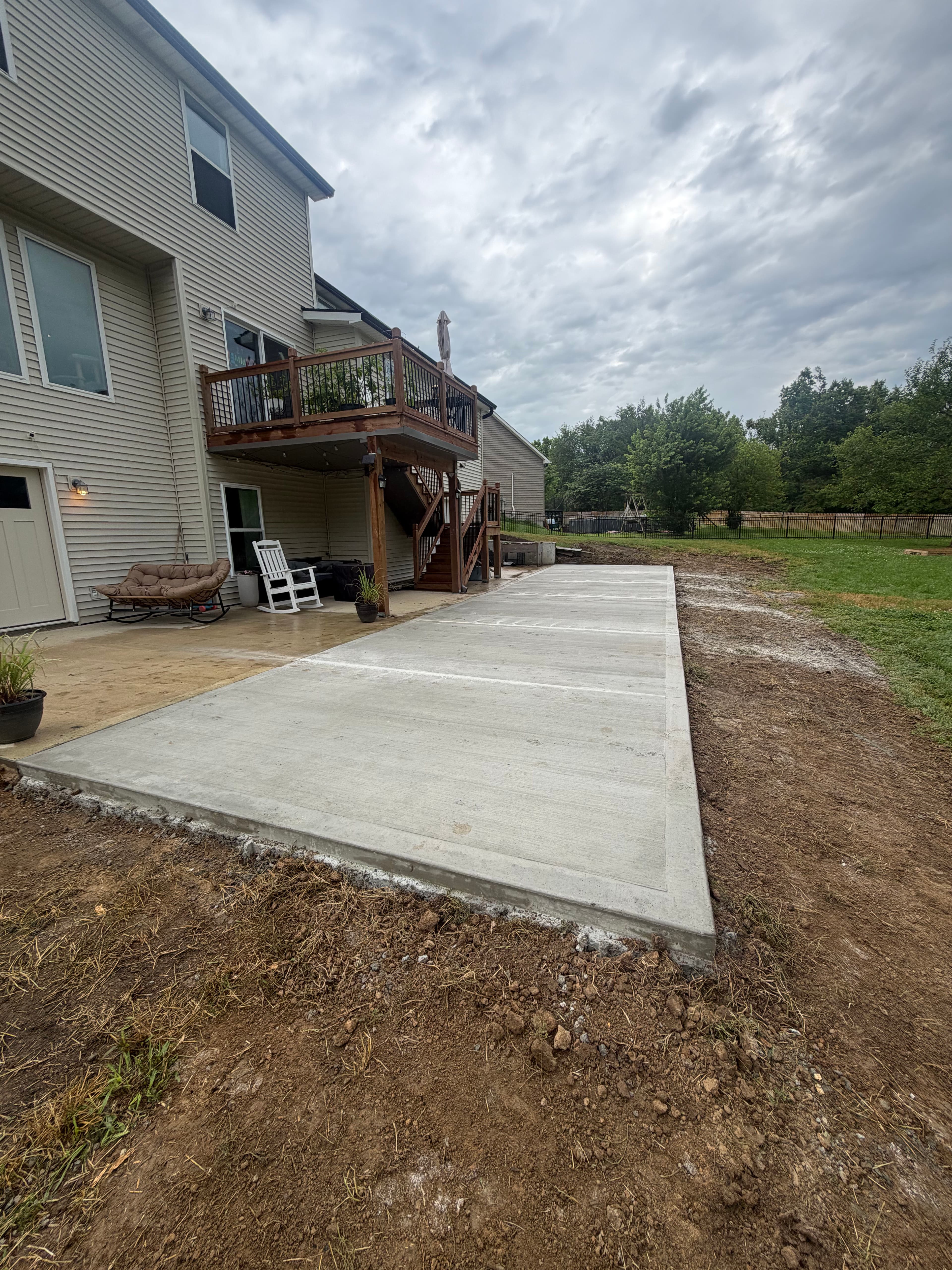Project Patio Extension with Retaining Wall and Rock Bed in Platte City image