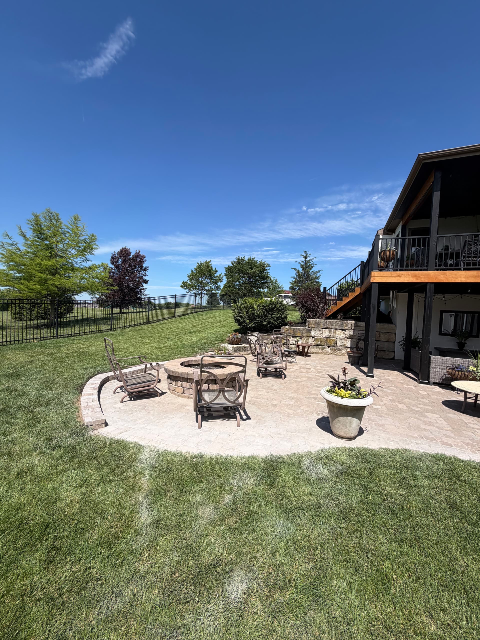 Paver Patio Reset With Drainage Fix and Retaining Wall